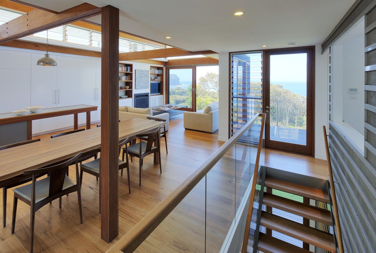 Stairs lead up to this open-plan kitchen and floor, house, interior design, real estate, window, wood, gray