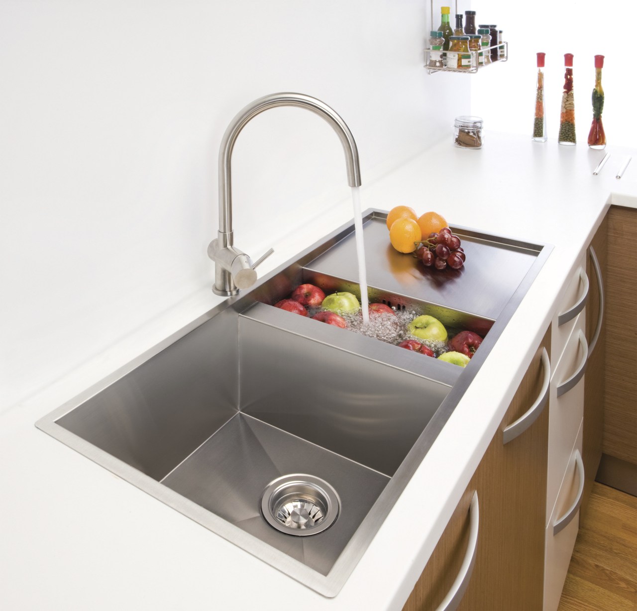 Sink with fruit and running water. bathroom sink, plumbing fixture, product design, sink, tap, white