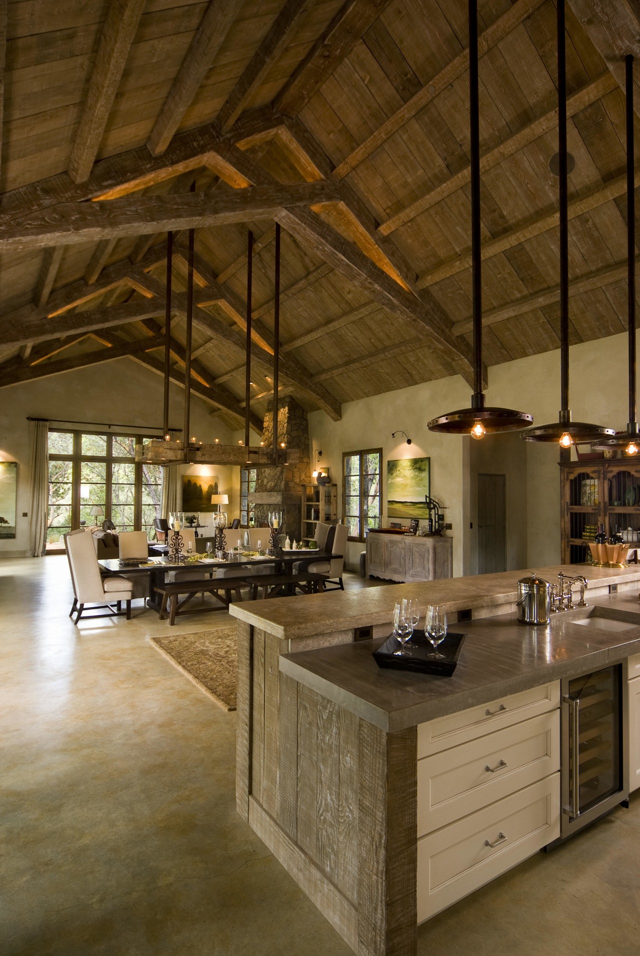 Rustic house modelled on French barn. Interiors feature beam, ceiling, countertop, interior design, kitchen, brown