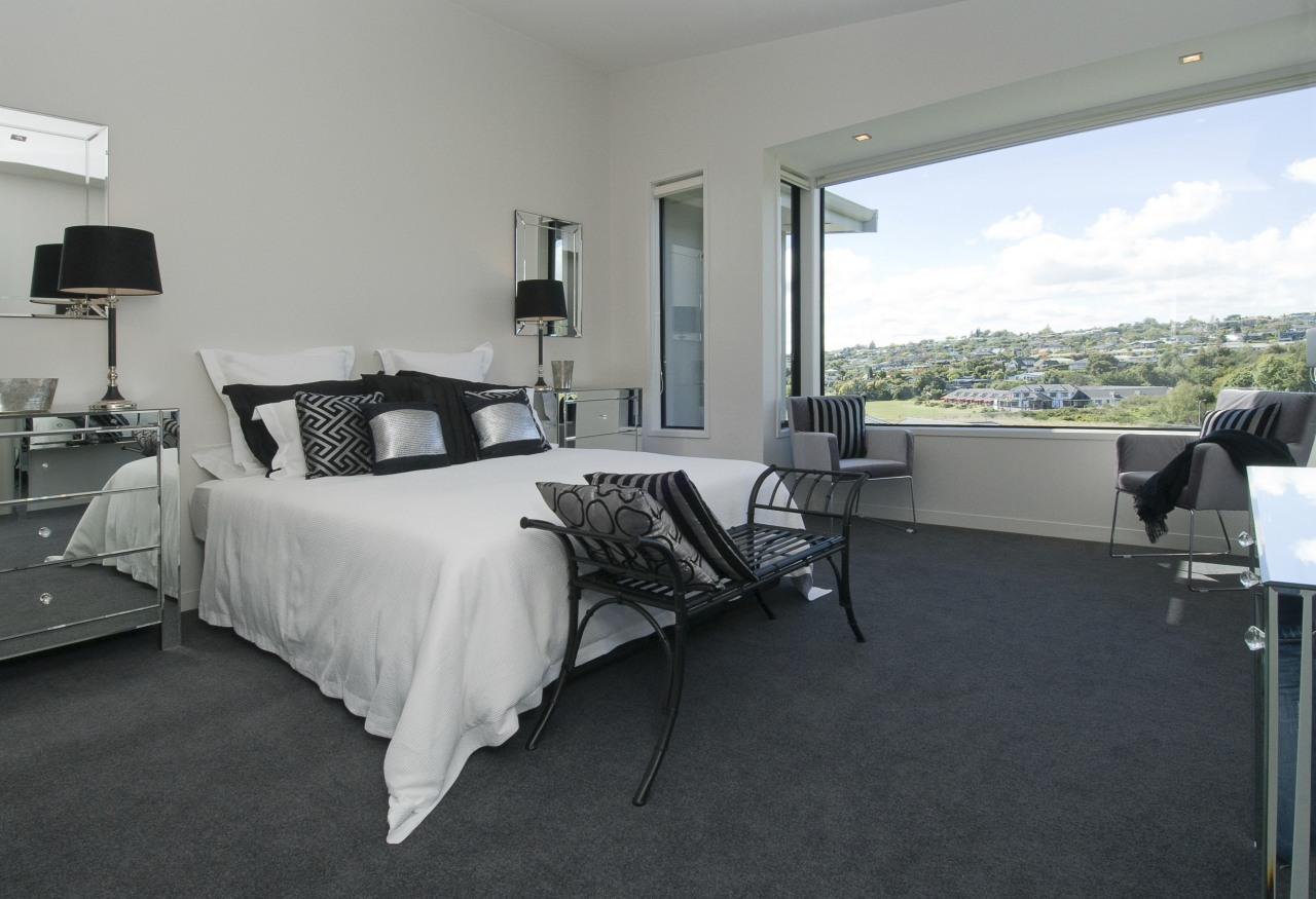The Moorings in Taupo by Haimes Building bed frame, bedroom, floor, flooring, home, interior design, property, real estate, room, window, gray, black