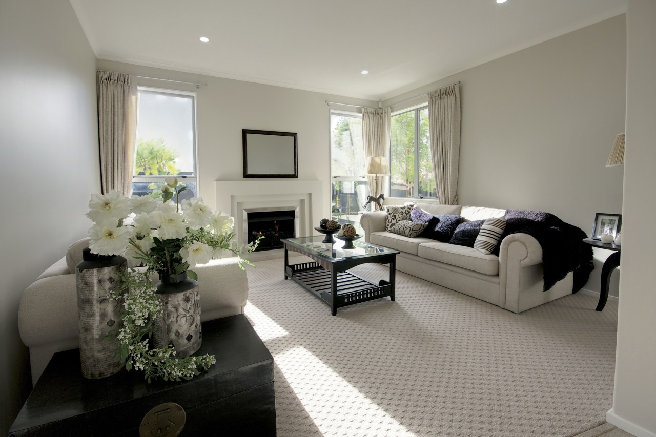 family area, plush couches, fireplace, muted colours ceiling, floor, home, interior design, living room, property, real estate, room, window, gray