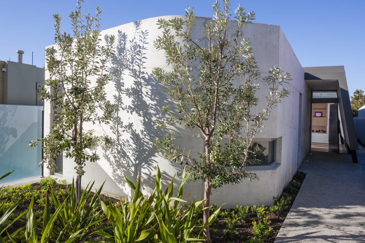 View of side house. architecture, facade, home, house, plant, property, real estate, residential area, tree, gray