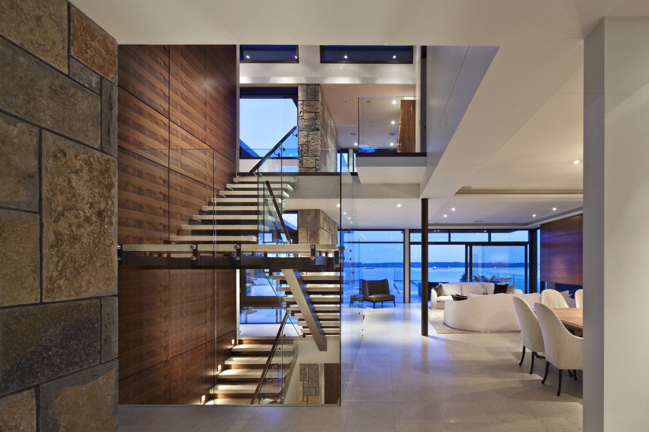 This is a home that was designed by architecture, ceiling, floor, interior design, lobby, loft, brown, gray