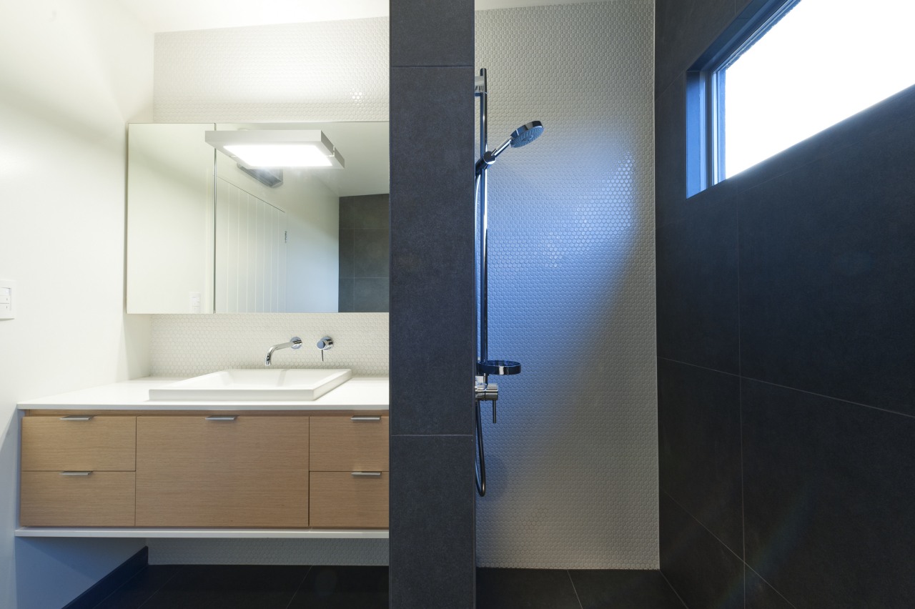 Open shower in bathroom with Basalt tiles, oak architecture, bathroom, bathroom accessory, bathroom cabinet, daylighting, interior design, product design, room, sink, black, white