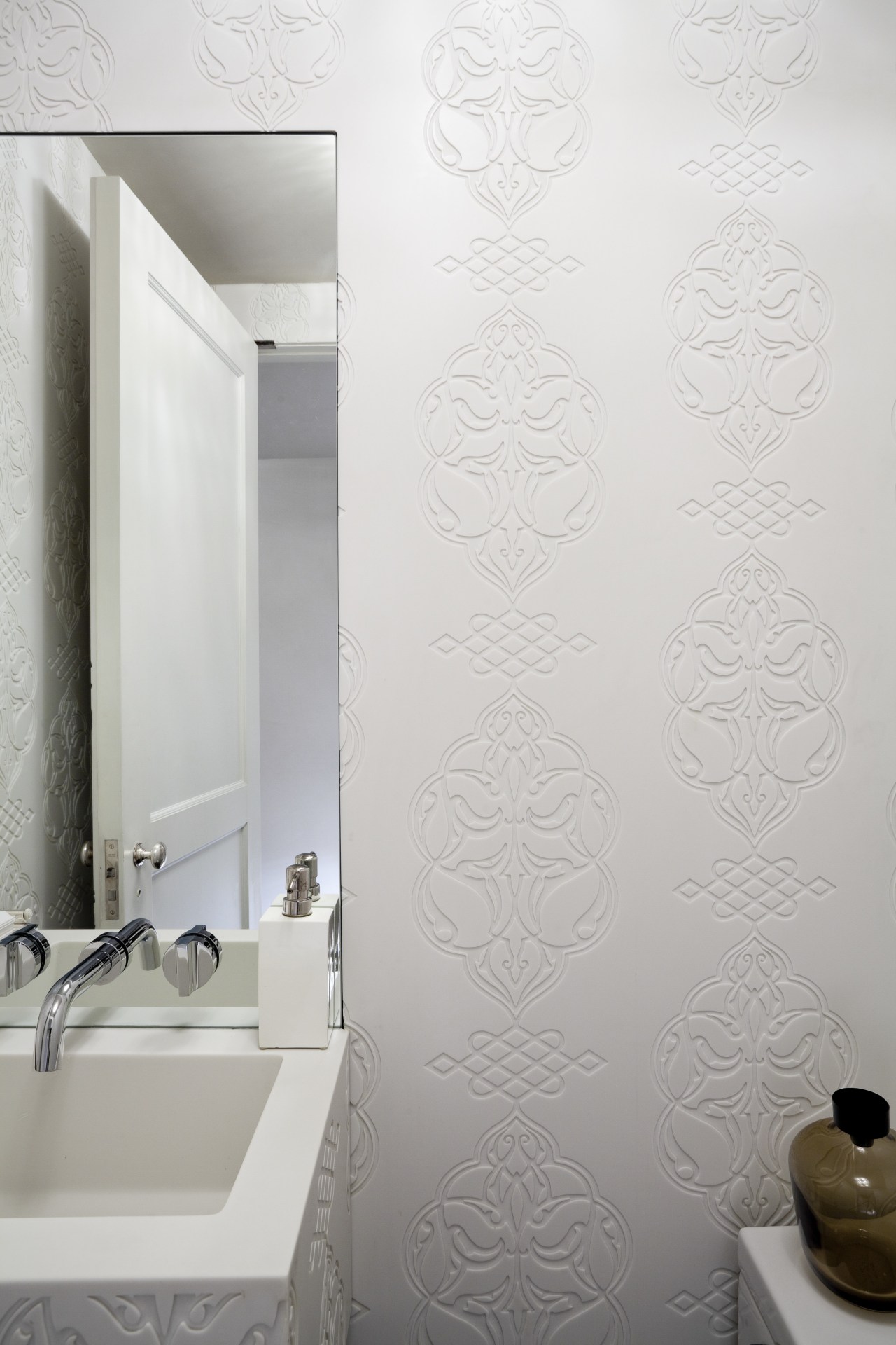 Custom-designed and fabricated Glacier White Corian clads every bathroom, ceramic, floor, flooring, interior design, plaster, plumbing fixture, product design, room, tap, tile, wall, white, gray