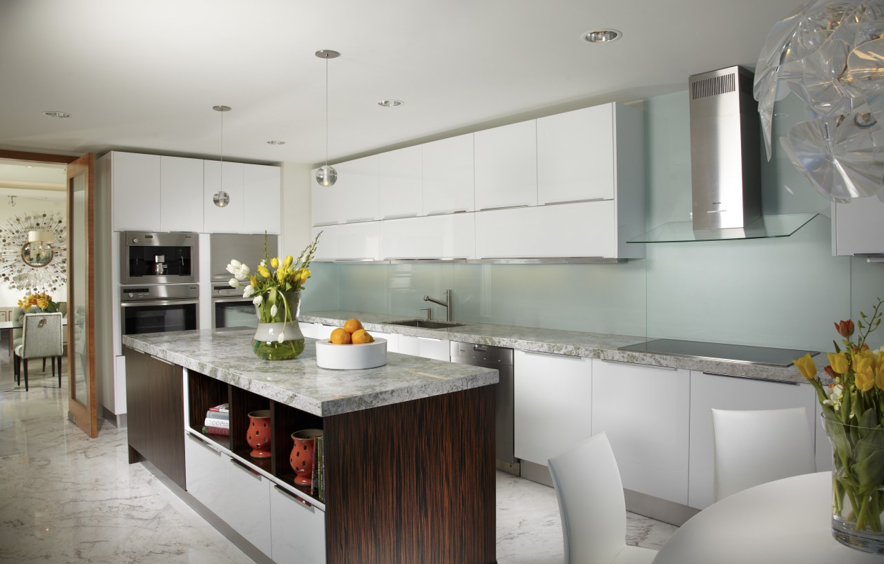 This kitchen in a Miami apartment has solid countertop, cuisine classique, interior design, kitchen, real estate, gray