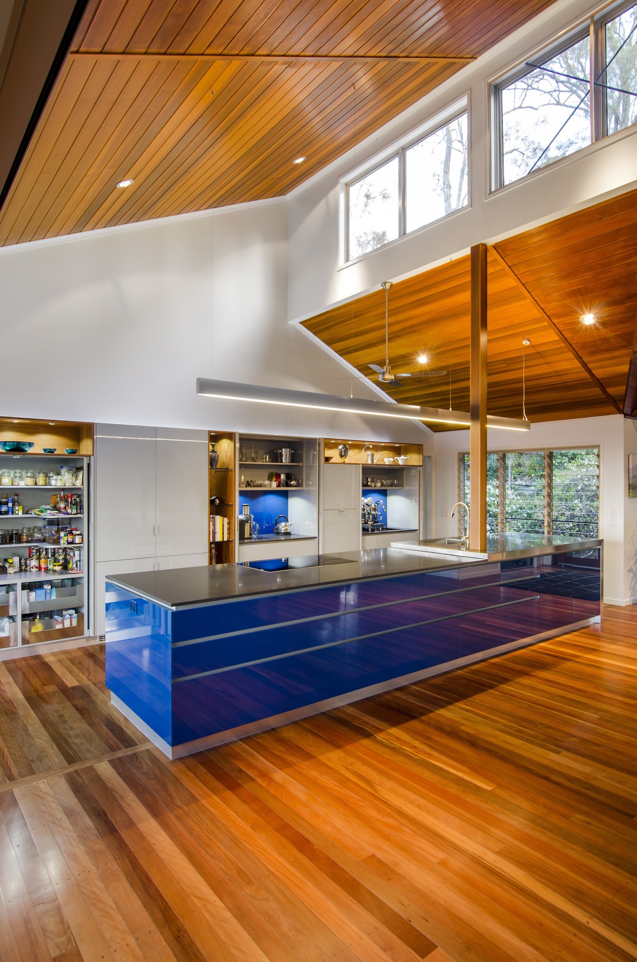 This kitchen was designed by Kim Duffin of architecture, ceiling, daylighting, floor, flooring, hardwood, house, interior design, laminate flooring, living room, lobby, loft, real estate, wood, wood flooring, orange, gray