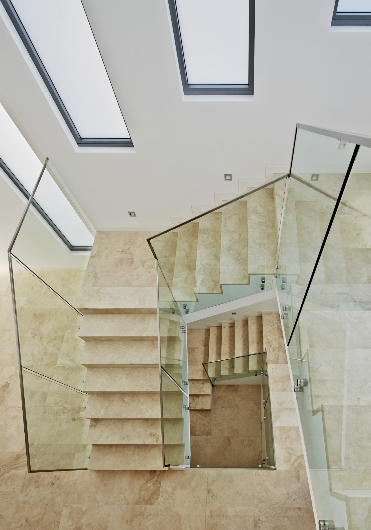 Marble staircase with glass balustrade by Starr Constructions architecture, ceiling, daylighting, estate, floor, handrail, home, house, interior design, property, real estate, stairs, gray