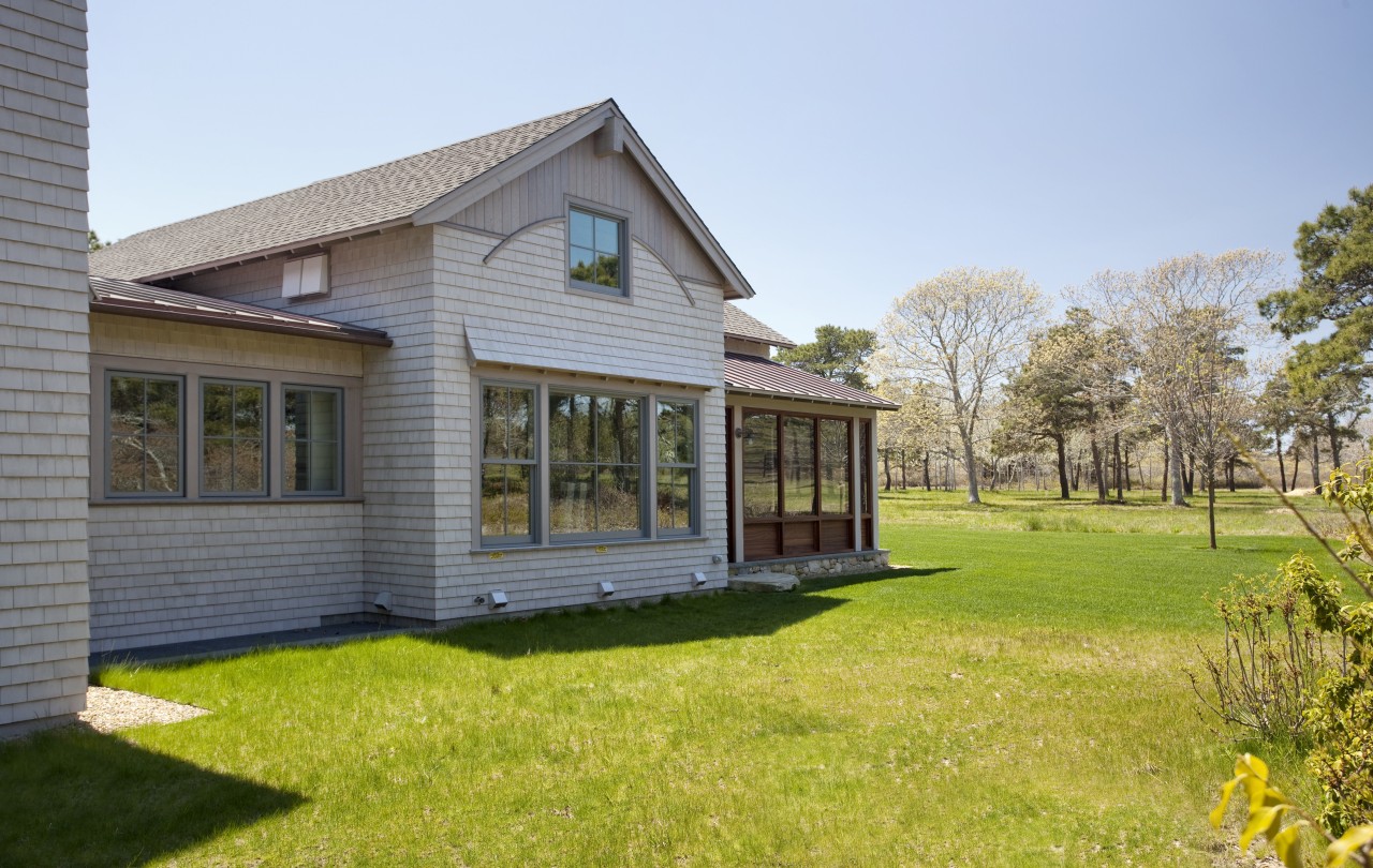 Exterior view of the home from the lawn. backyard, cottage, estate, facade, farmhouse, grass, home, house, property, real estate, siding, window, yard