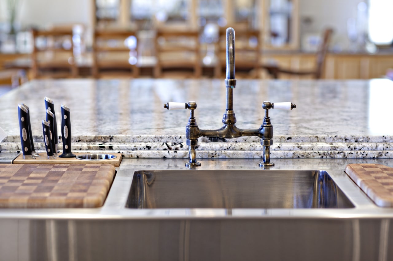 The business end of the main island in countertop, water, wood, gray