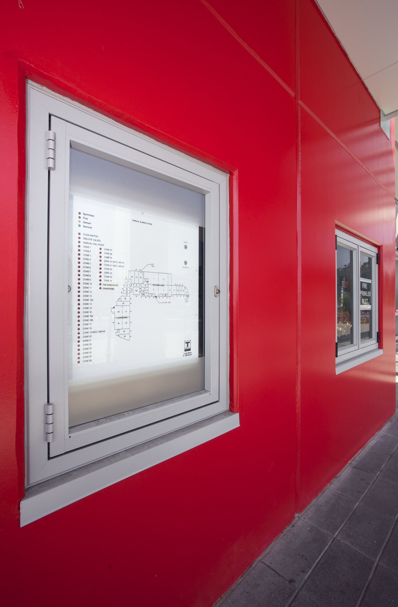 Protech Designs fire protection for Silverdale Centre wall, window, red, gray
