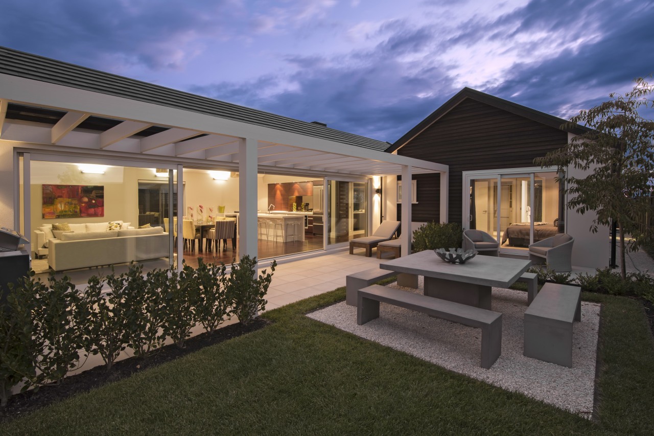 The Life at Home street of show homes backyard, cottage, elevation, estate, facade, home, house, lighting, property, real estate, residential area, villa, window, black