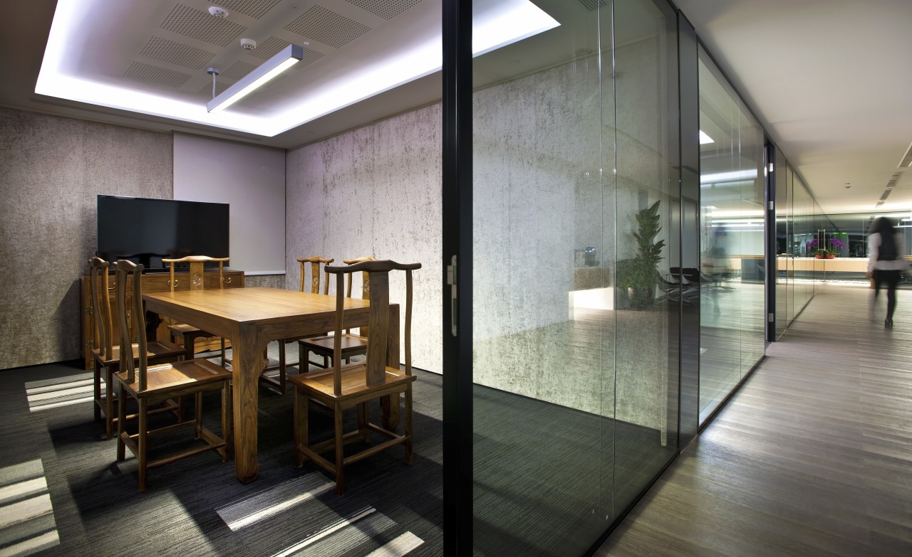 This meeting space in the Beijing office of architecture, ceiling, floor, flooring, interior design, lobby, gray, black