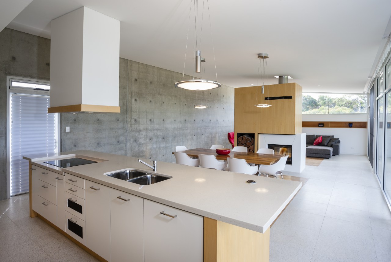 A predominently white kitchen island, with hanging extractor architecture, countertop, cuisine classique, interior design, kitchen, real estate, room, gray