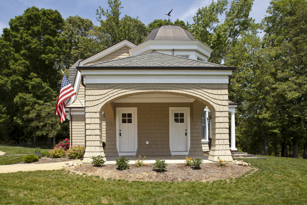 This John Malick-designed house has an air of building, cottage, estate, facade, farmhouse, historic house, home, house, property, real estate, siding, brown
