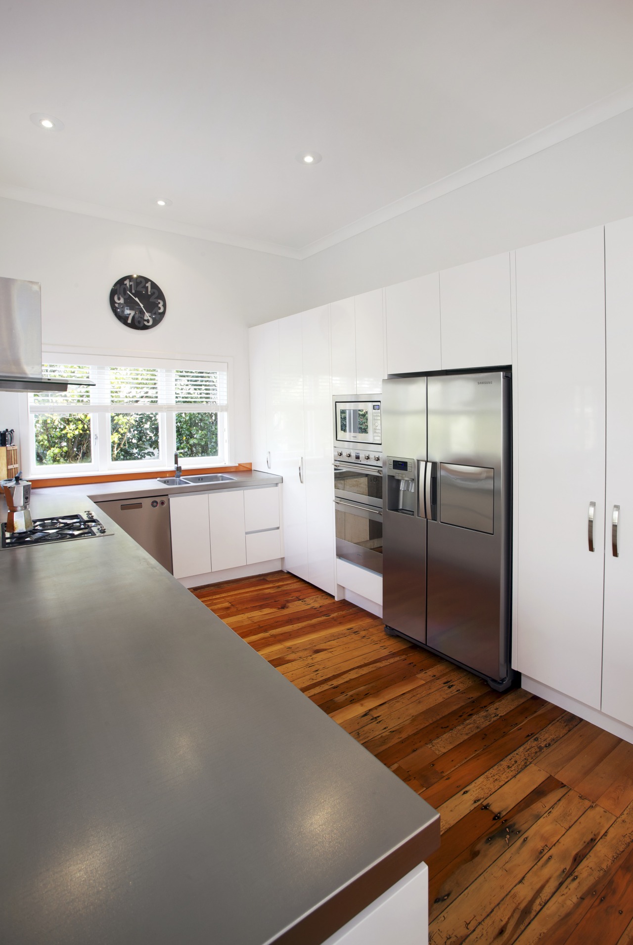 This clean-lined kitchen is by  RH Cabinetmakers countertop, floor, house, interior design, kitchen, real estate, gray