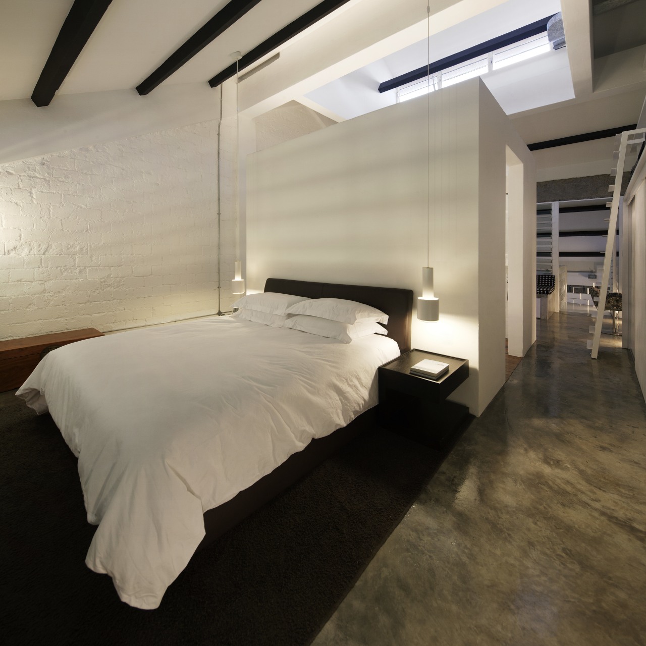 This bedroom in an office-apartment conversion by designer architecture, bed frame, bedroom, ceiling, floor, flooring, interior design, lighting, room, suite, wood, orange, black