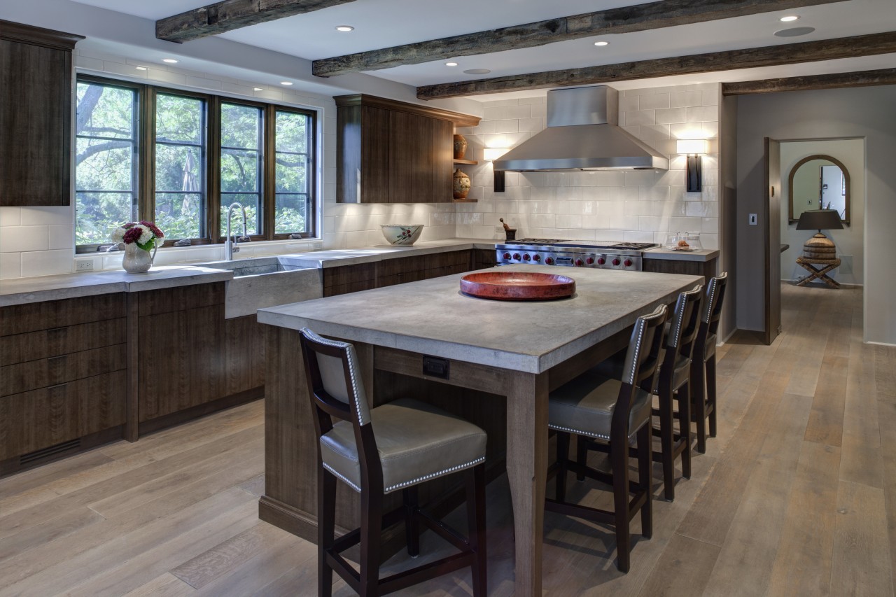 In this kitchen remodel by Doug Durbin, the cabinetry, countertop, cuisine classique, floor, flooring, hardwood, interior design, kitchen, laminate flooring, room, wood flooring, gray, black