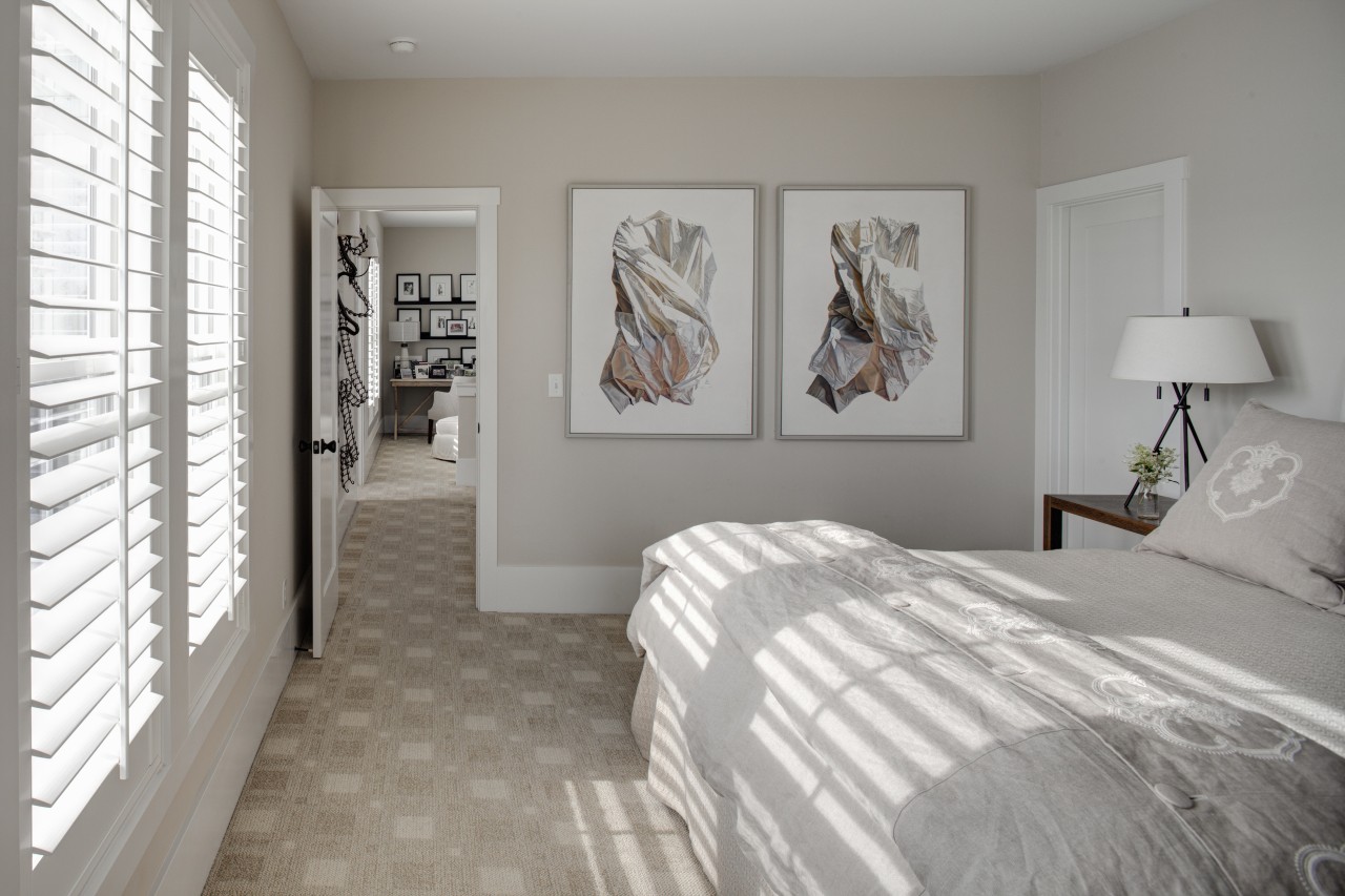 White, wooden shutters filter light into this traditional bedroom, ceiling, floor, flooring, home, interior design, real estate, room, wall, window, gray