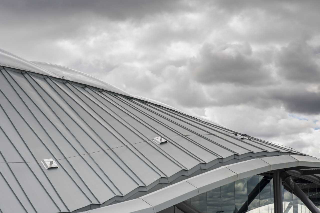 The roof was chosen in part for its architecture, building, cloud, daylighting, daytime, facade, line, roof, sky, structure, gray