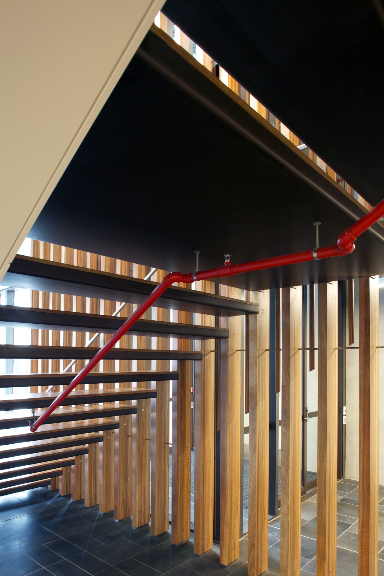 AFS Total Fire Protection supplied and installed the architecture, daylighting, handrail, lighting, stairs, structure, wood, black