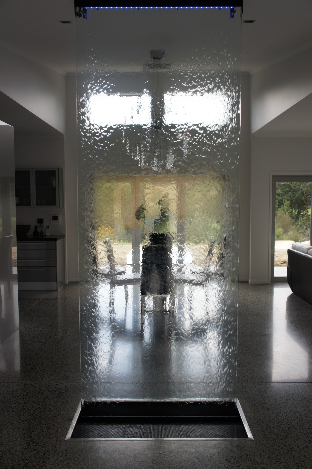 Waterworks indoor water feature.  A shimmering sheet architecture, ceiling, floor, flooring, glass, interior design, lobby, tourist attraction, wall, black