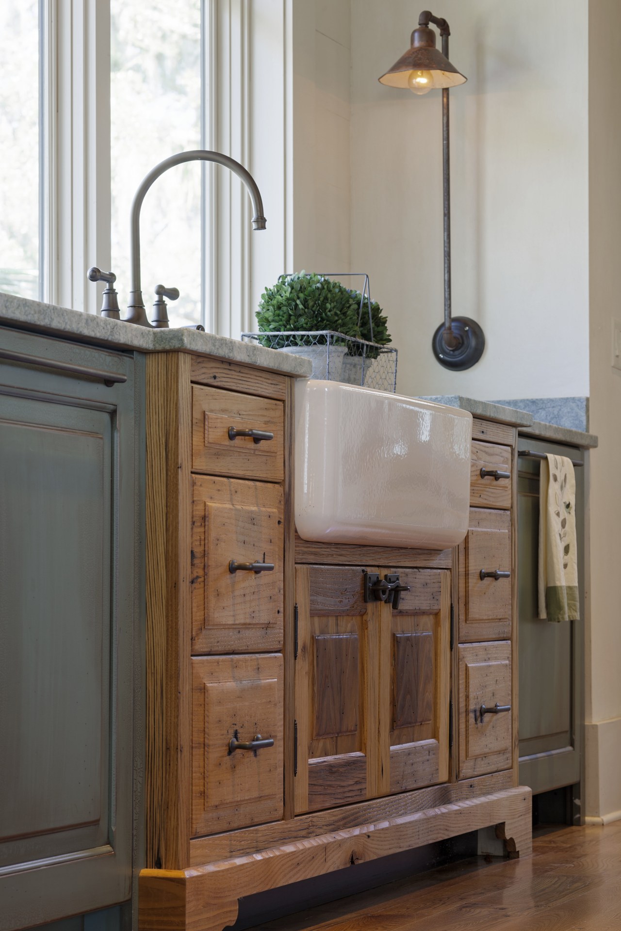 This sink cabinet juts out into the room, bathroom, bathroom accessory, bathroom cabinet, cabinetry, chest of drawers, countertop, cuisine classique, drawer, floor, furniture, hardwood, kitchen, room, sideboard, sink, wood, wood stain, gray, brown