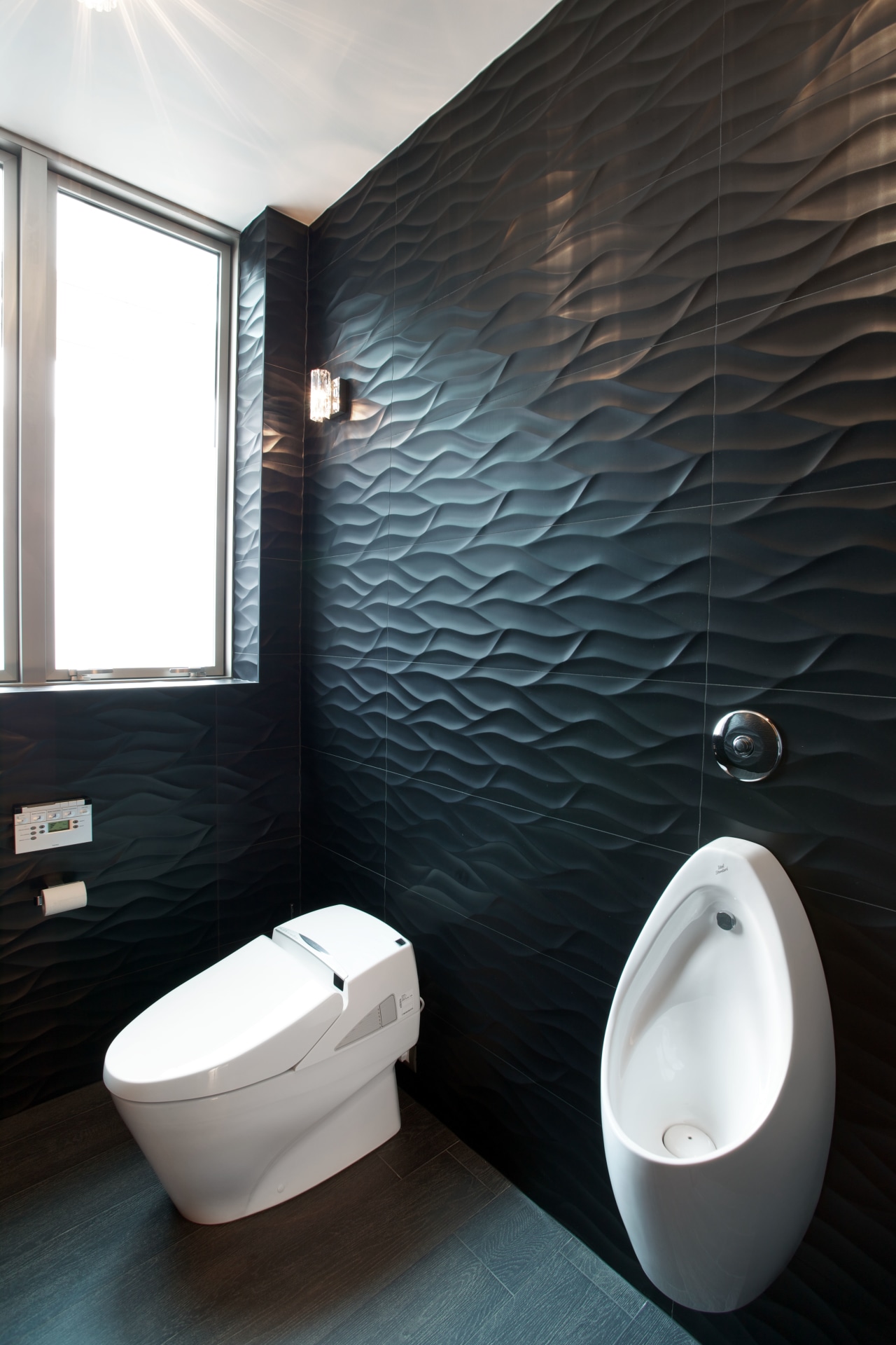 The wall tiles lining the toilet area in bathroom, bidet, ceramic, floor, interior design, plumbing fixture, product design, room, tap, toilet, toilet seat, black