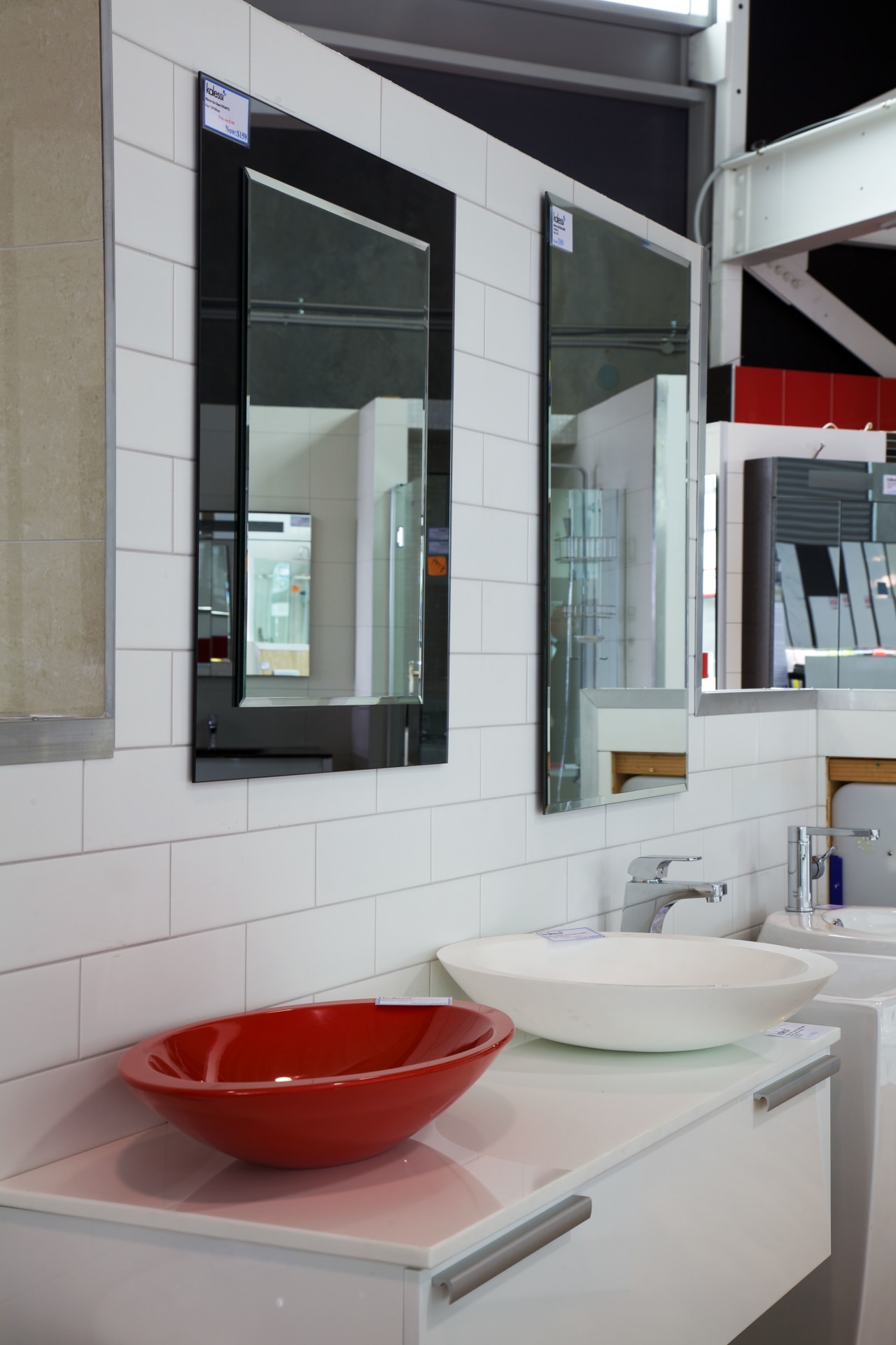 This showroom also features an extensive collection of bathroom, interior design, sink, gray