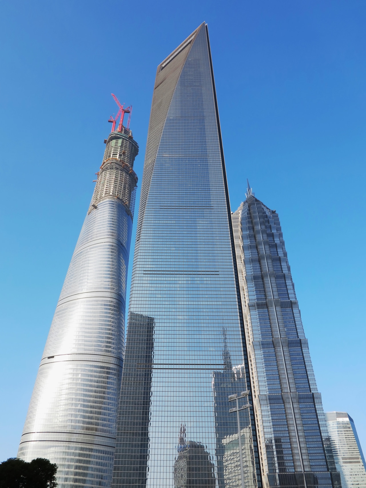 Shanghai Tower will deliver much needed supply to architecture, building, city, commercial building, condominium, corporate headquarters, daytime, headquarters, landmark, metropolis, metropolitan area, national historic landmark, sky, skyline, skyscraper, tower, tower block, urban area, teal, blue