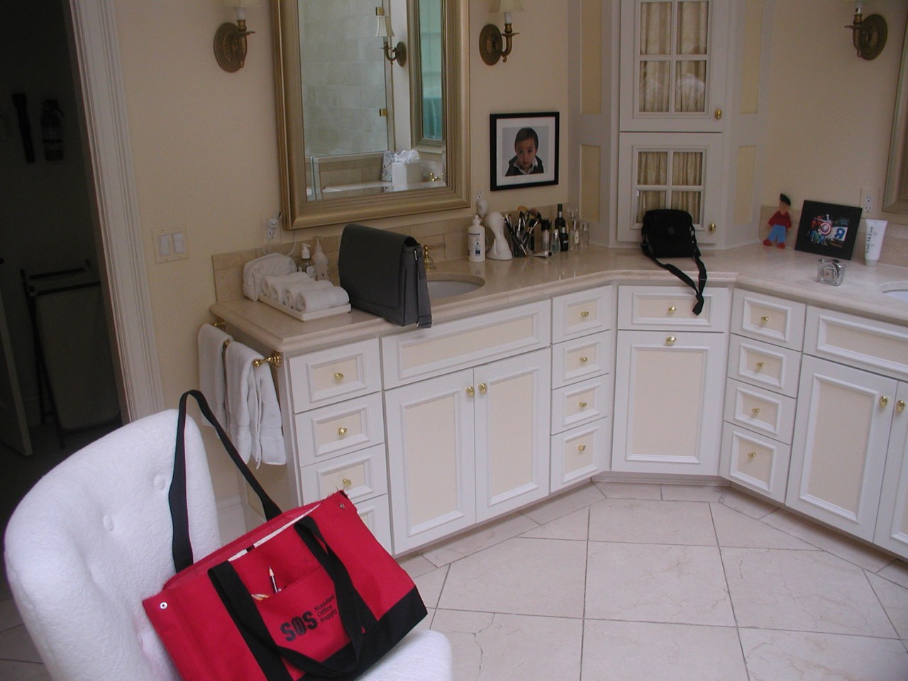 Before remodeling, this bathroom featured fully fitted cabinets cabinetry, countertop, floor, flooring, furniture, home, house, kitchen, property, room, gray