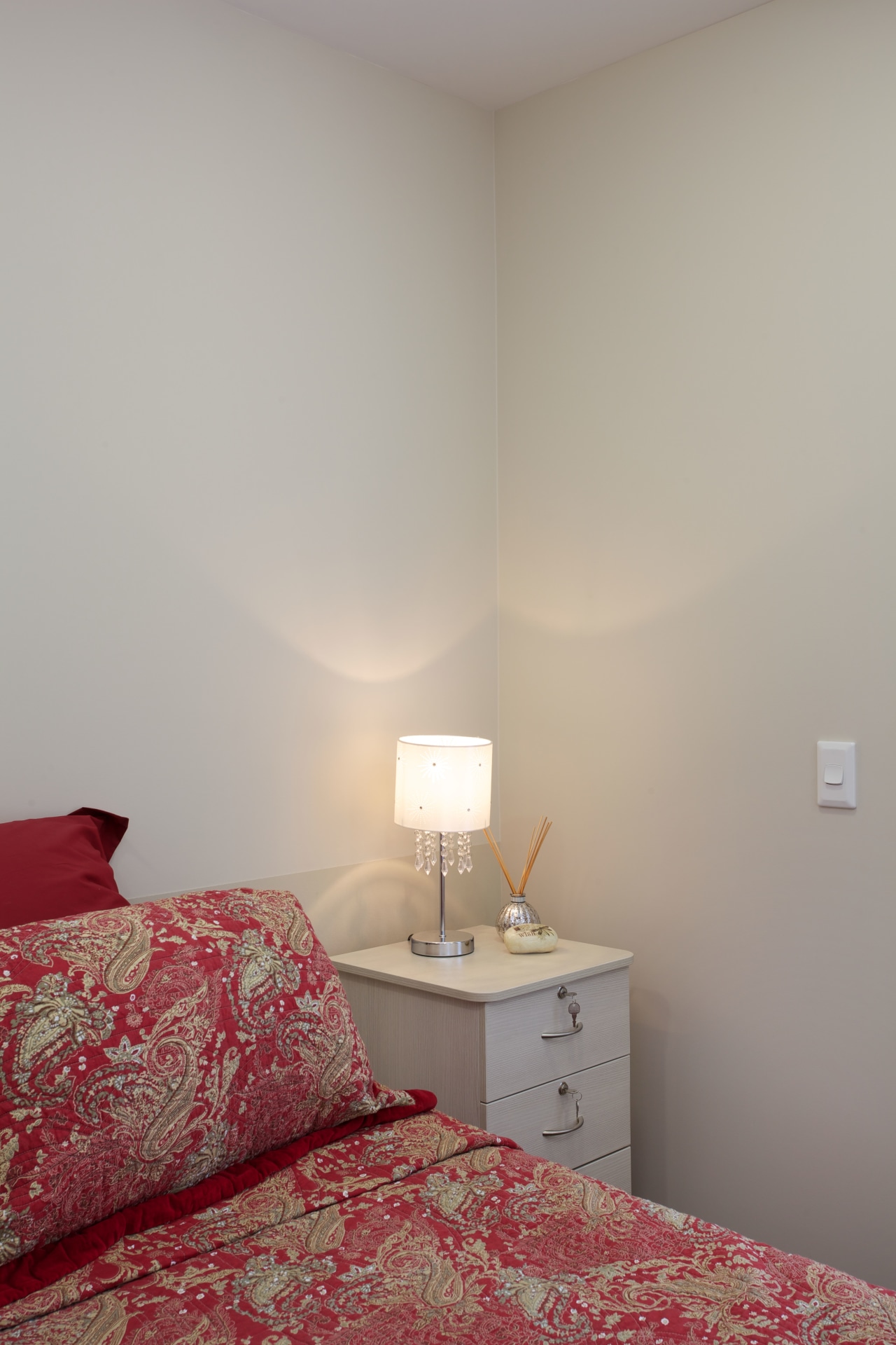 In the Care Suites at Eden Village the bed, bedroom, ceiling, daylighting, floor, furniture, home, house, interior design, light, room, wall, window, wood, gray