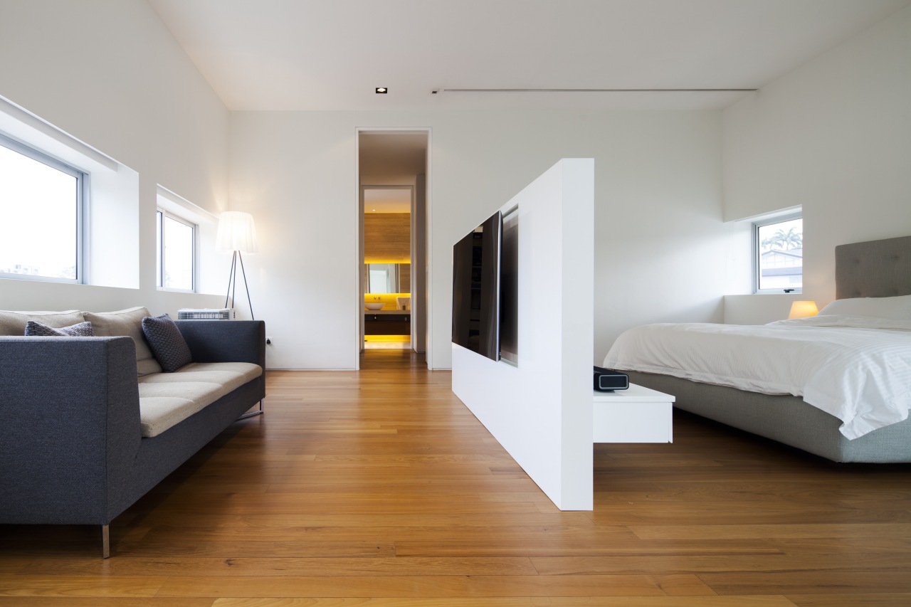 A freestanding wall divides this master suite and architecture, bed, bed frame, bedroom, ceiling, floor, flooring, furniture, hardwood, interior design, laminate flooring, real estate, room, suite, wood, wood flooring, gray