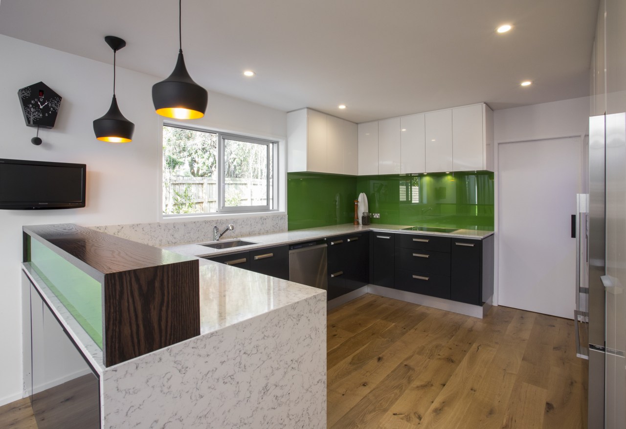 The green glass splashback and Silestone benchtops form cabinetry, countertop, floor, interior design, kitchen, property, real estate, room, gray