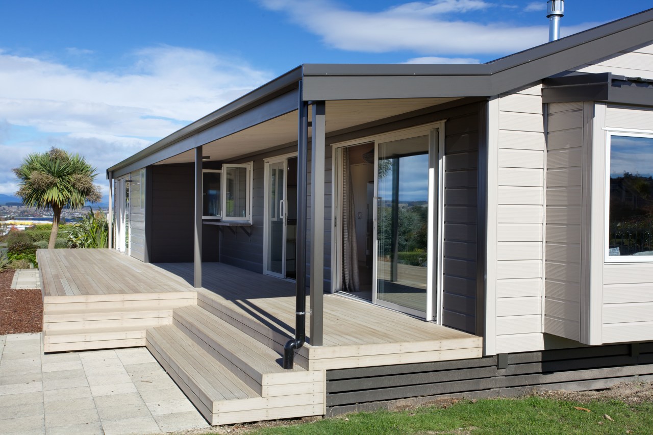 Clad in low-maintenance cedar and aluminium cladding, the facade, home, house, property, real estate, siding, window, white