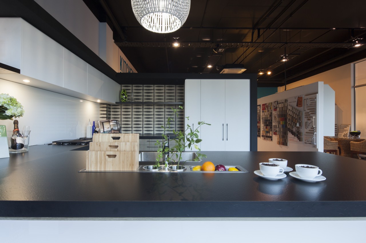 Modern black and white kitchen with grey-toned wood interior design, black