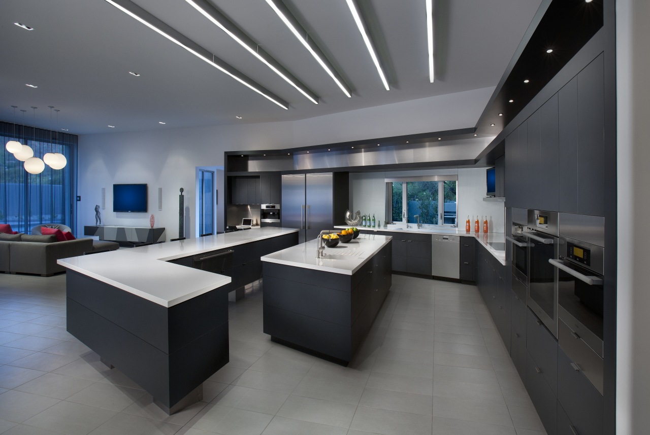 The adjoining kitchen cabinetry features a dark Raven interior design, gray, black