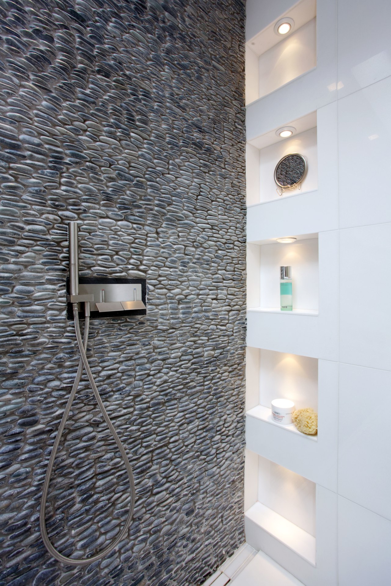 Wall-mounted faucets enhance the streamlined look of this bathroom, ceiling, floor, flooring, interior design, tile, wall, gray, white