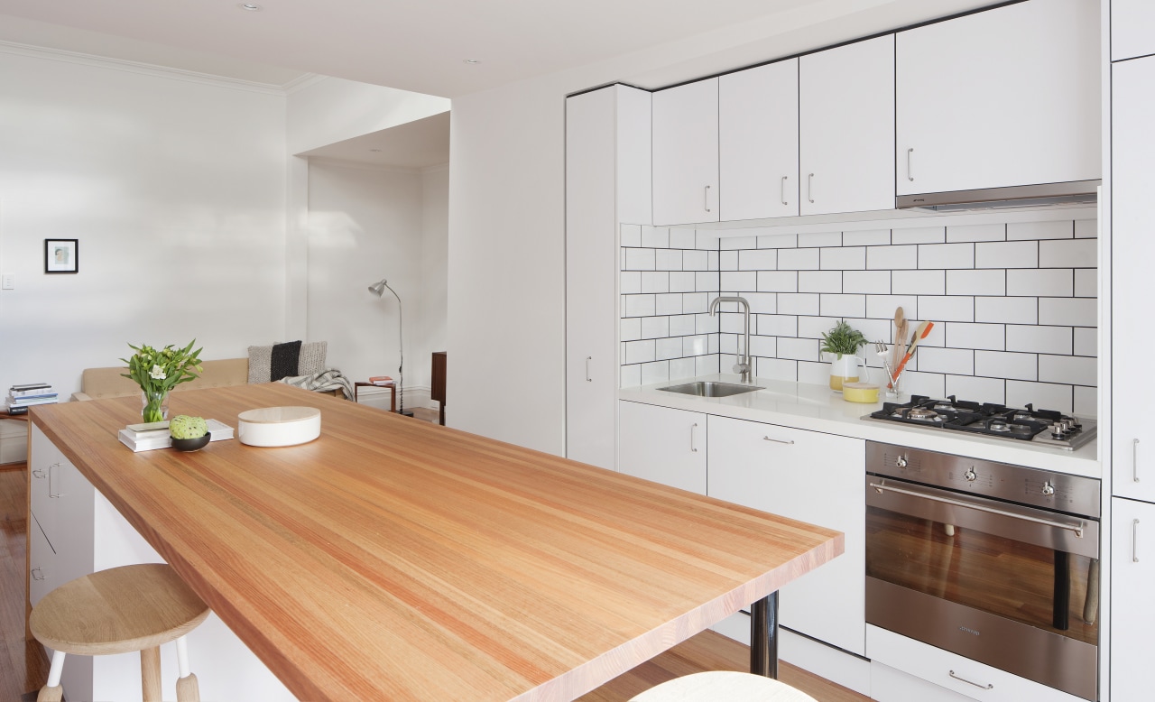 White cabinets, subway tiles and mid-tone timber finishes countertop, cuisine classique, floor, interior design, kitchen, property, real estate, gray