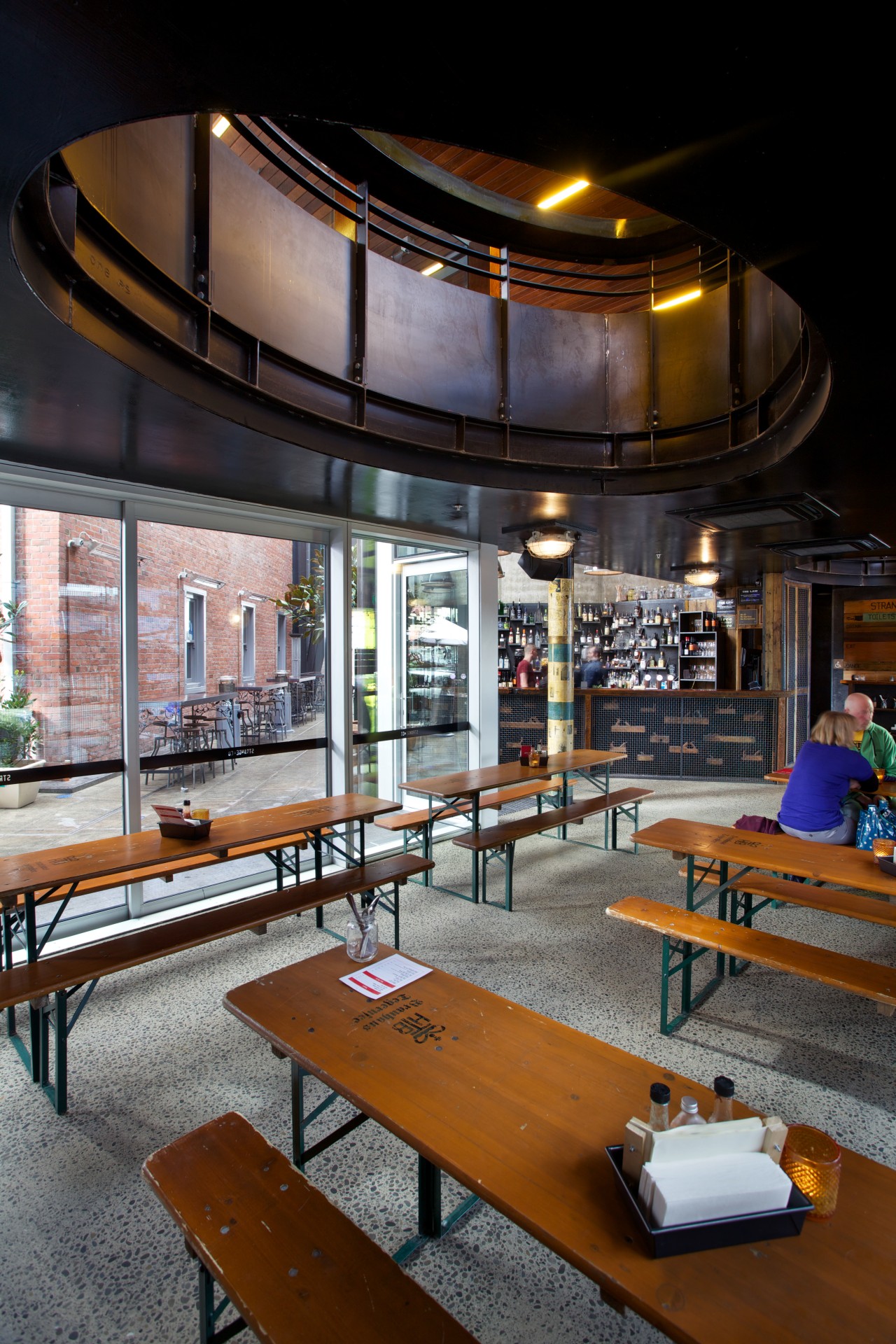 A large opening in the mezzanine floor of interior design, table, black, gray