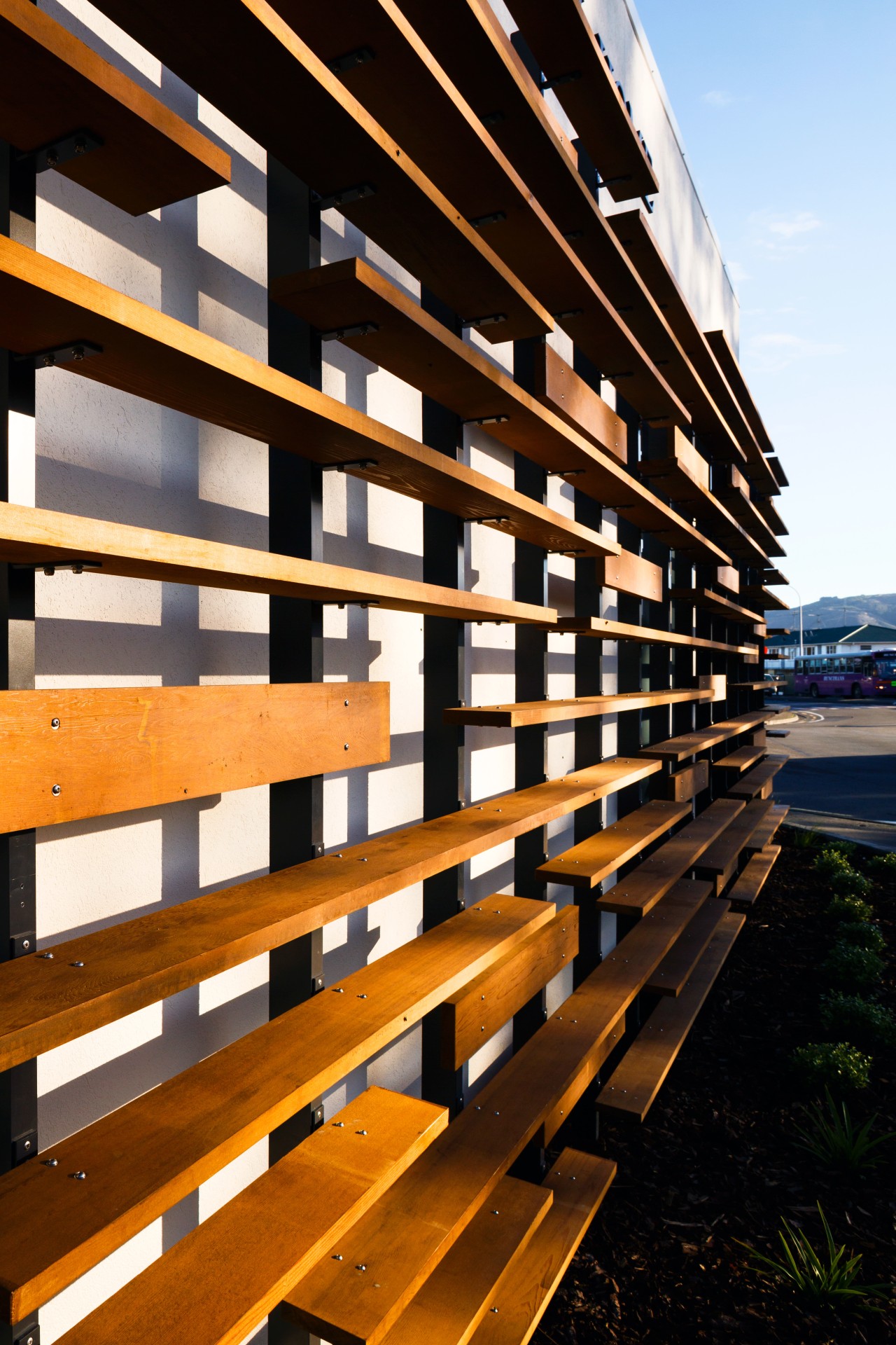 The cedar screen on this new funeral home architecture, building, condominium, daylighting, facade, line, lumber, sky, wood, black