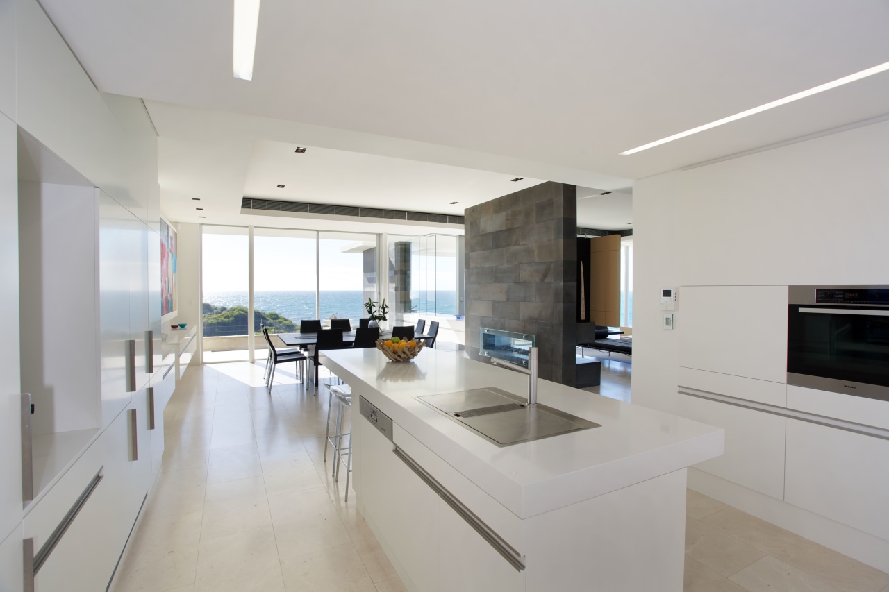 This all-white kitchen has been kept deliberately simple. apartment, architecture, countertop, house, interior design, kitchen, property, real estate, gray