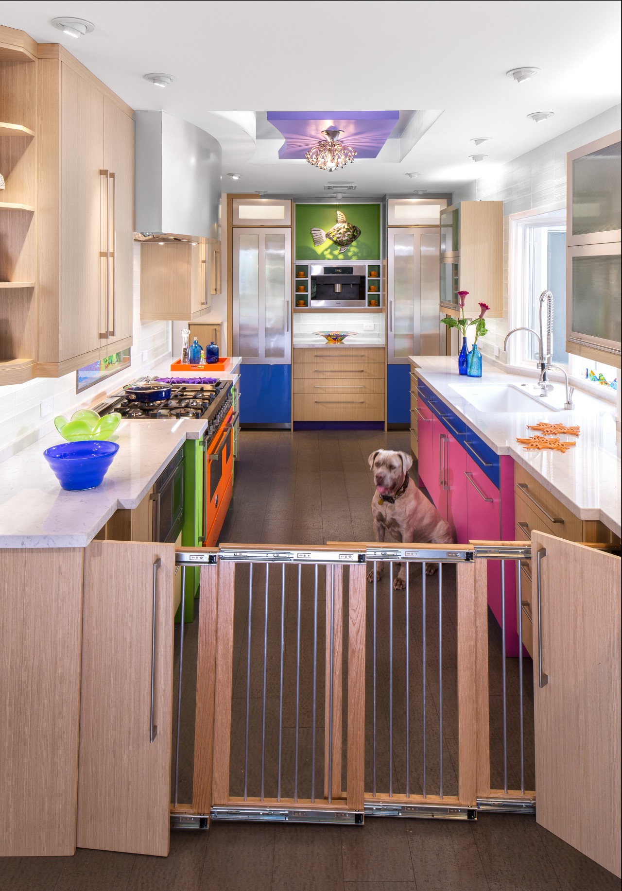 This colorful kitchen by Elina Katsioula-Beall features a cabinetry, countertop, floor, interior design, kitchen, room, white