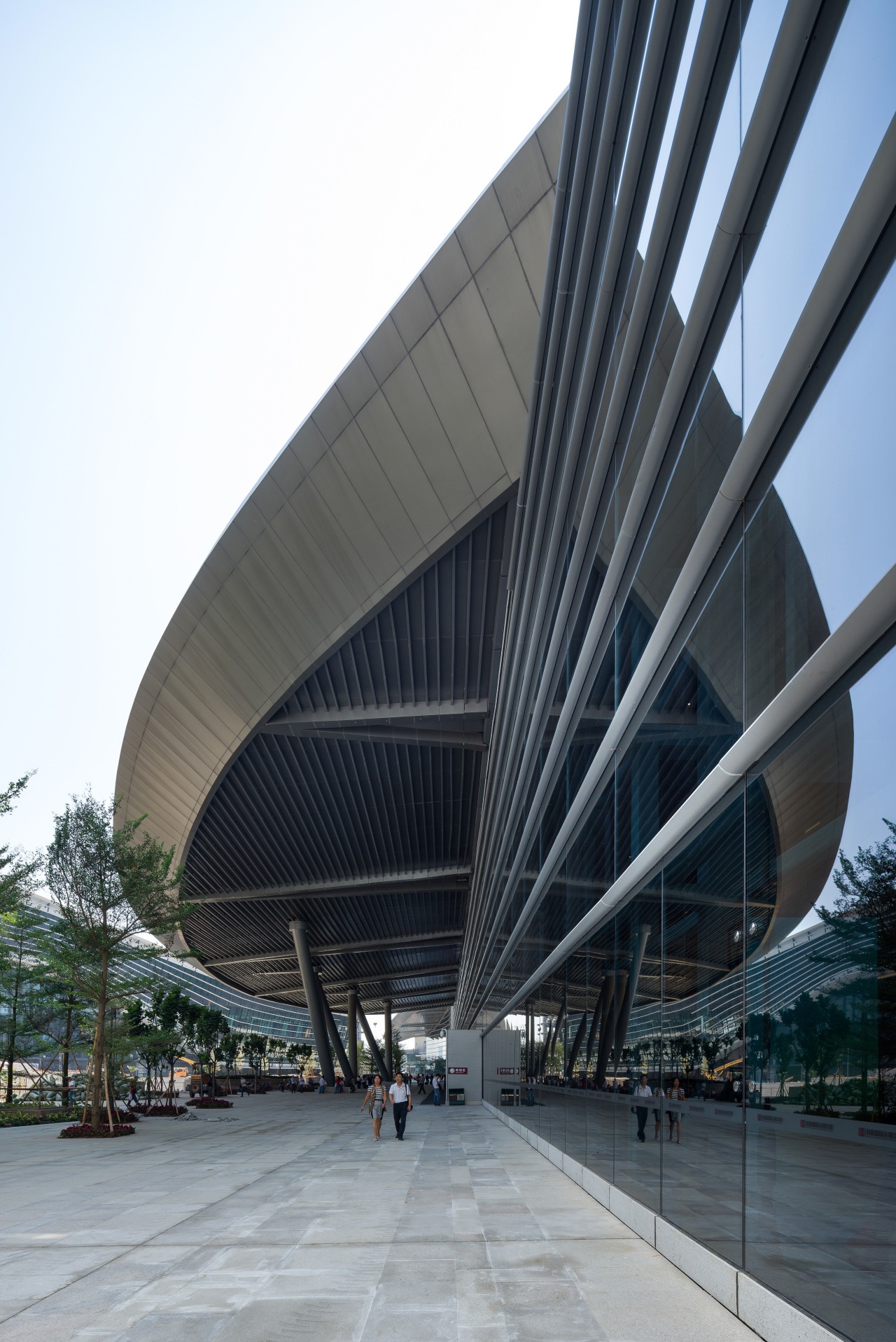 The Zhuhai International Convention and Exhibition Centre designed architecture, building, convention center, corporate headquarters, daylighting, daytime, facade, fixed link, headquarters, infrastructure, metropolis, metropolitan area, mixed use, sky, skyway, structure, black, white