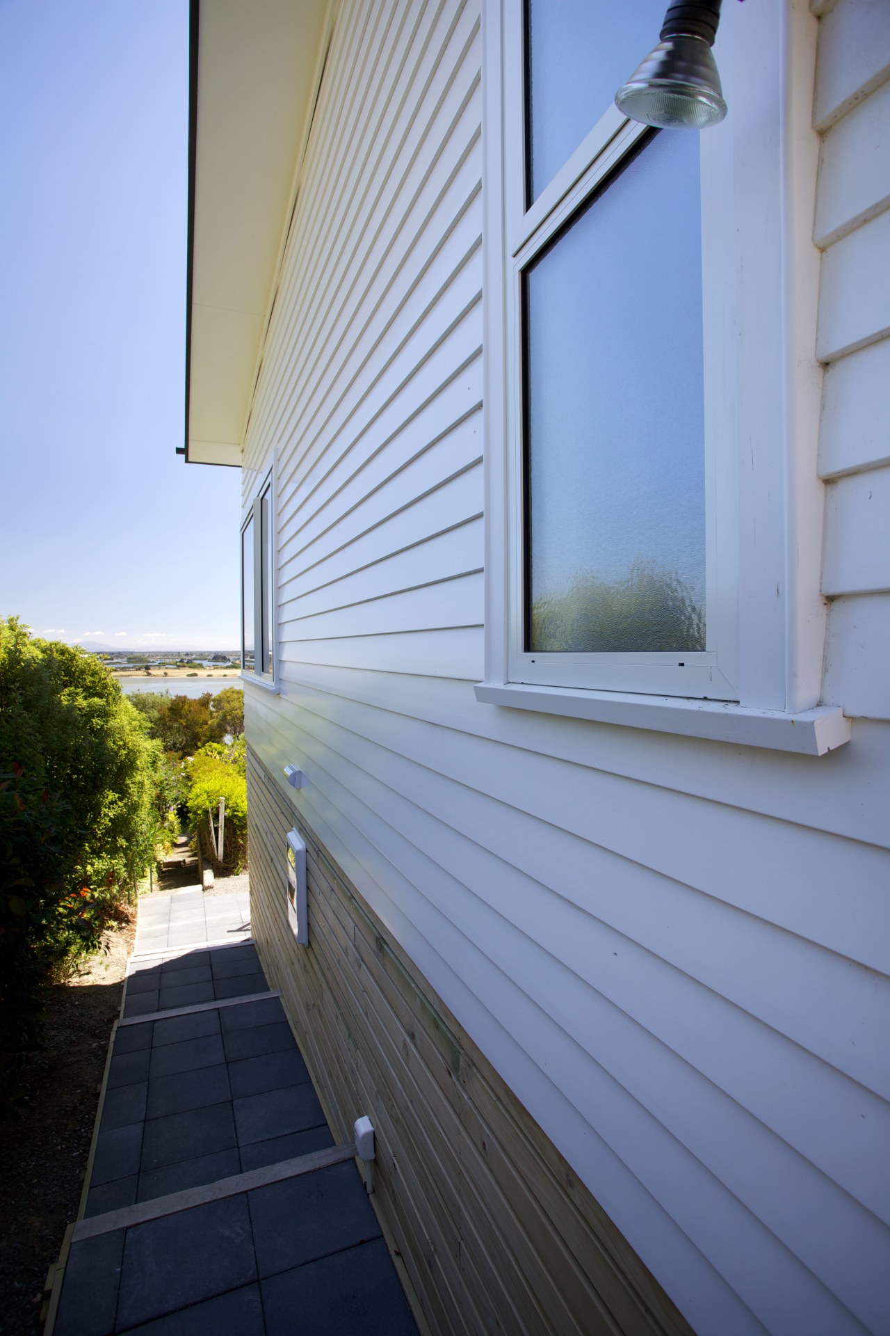 Palliside is a low-maintenance cladding solution that never architecture, building, daylighting, facade, home, house, real estate, residential area, roof, siding, sky, window, wood, teal