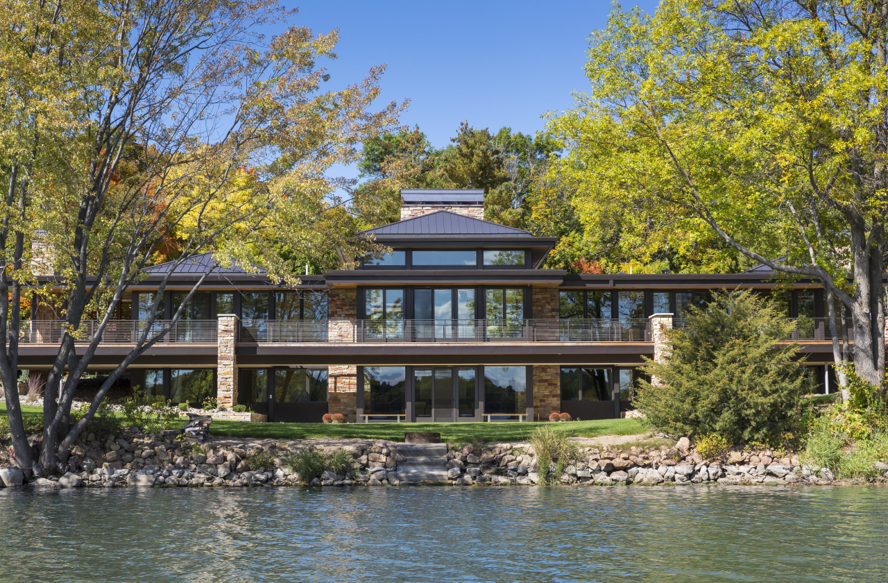 This new home, designed by Charles R Stinson bayou, canal, cottage, estate, home, house, lake, mansion, plant, property, real estate, reflection, tree, villa, water, waterway, brown