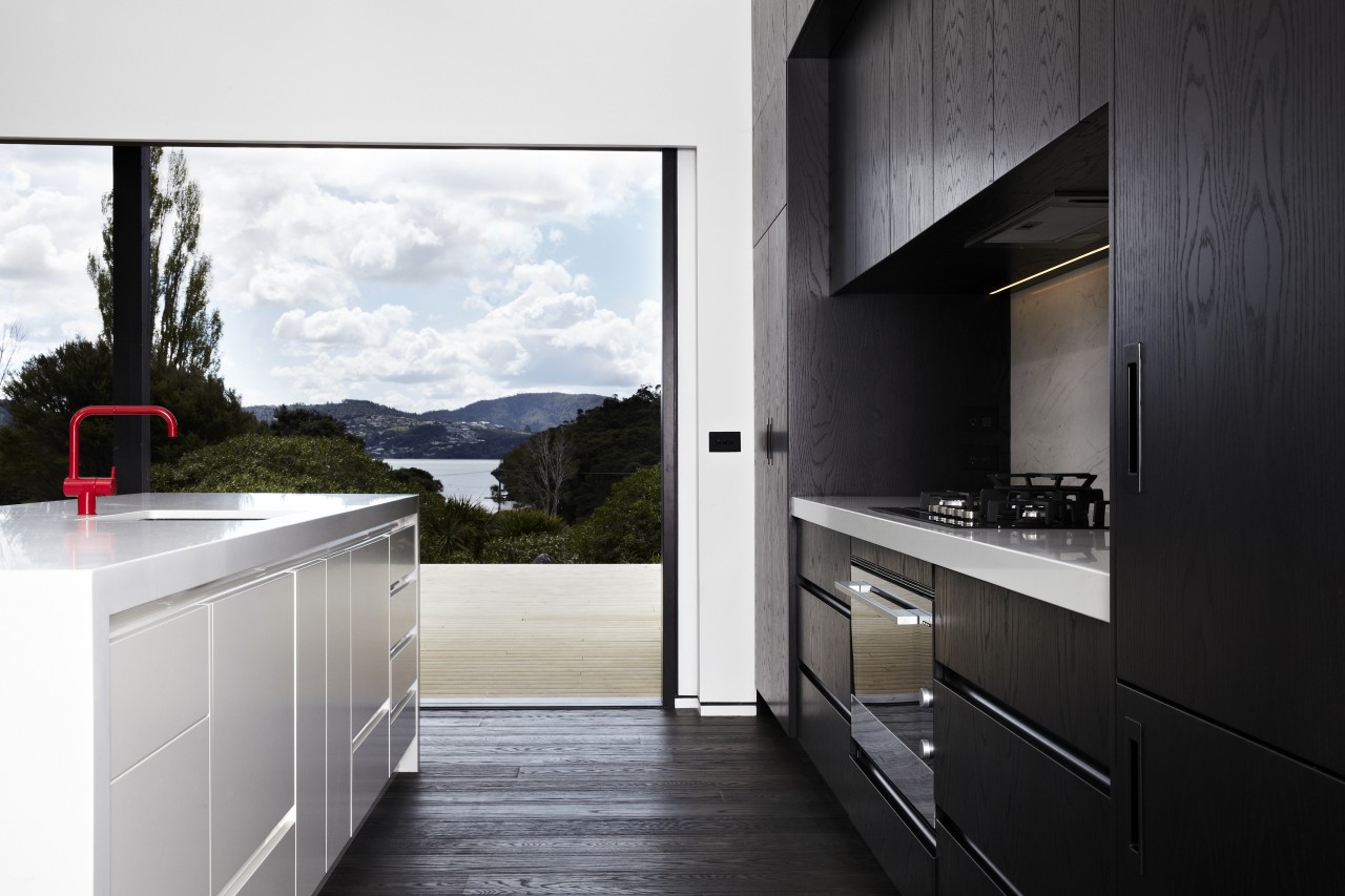 This kitchen, in a modern beach house designed architecture, countertop, home, home appliance, house, interior design, kitchen, real estate, black, white