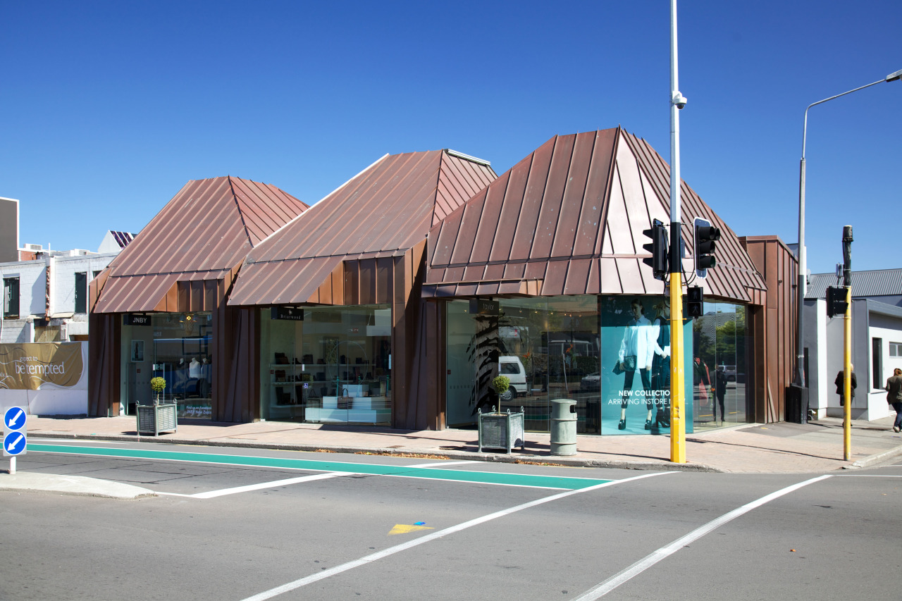 Canopies above the entry to each store in architecture, building, city, downtown, house, neighbourhood, real estate, residential area, sky, town, gray, blue