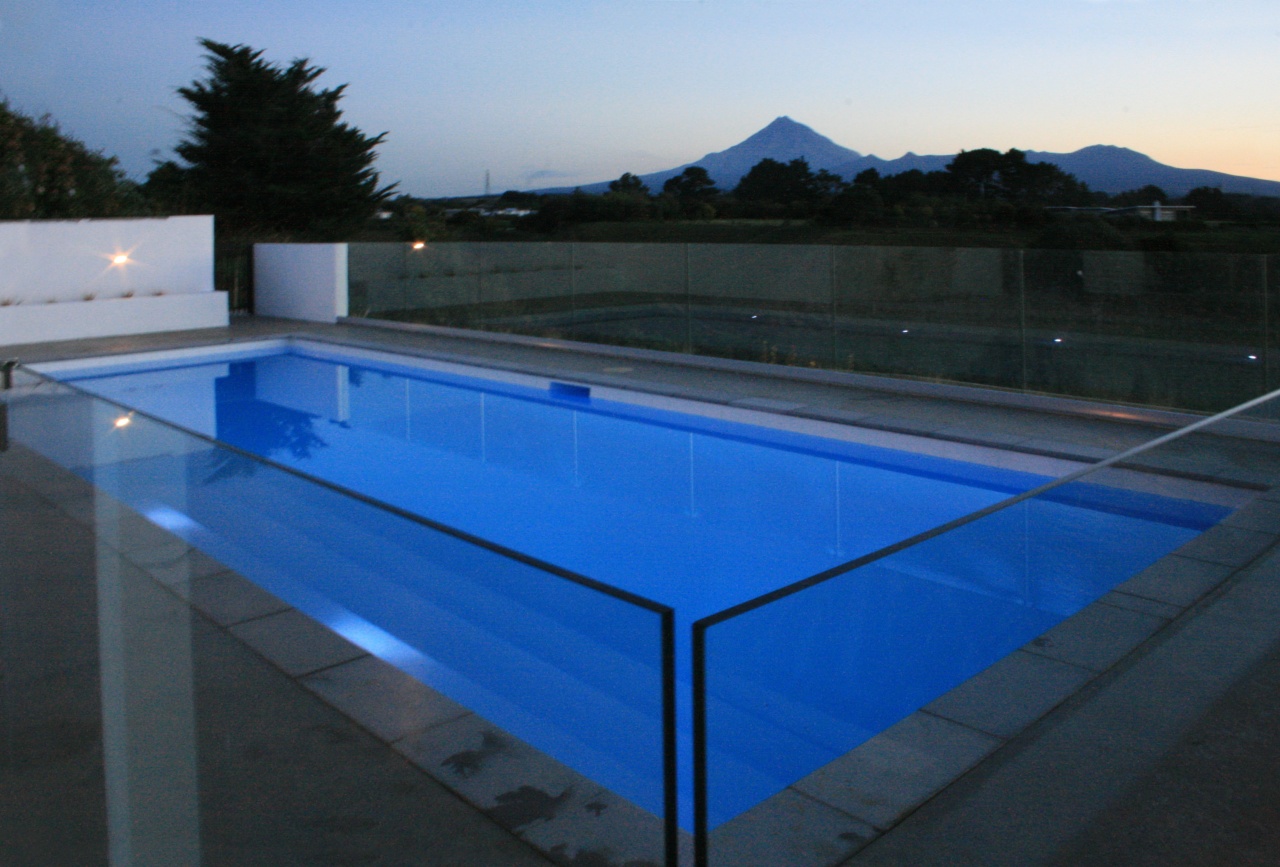 This fibreglass pool by Mayfair Pools features an daylighting, glass, leisure, lighting, property, roof, structure, swimming pool, water, black, blue