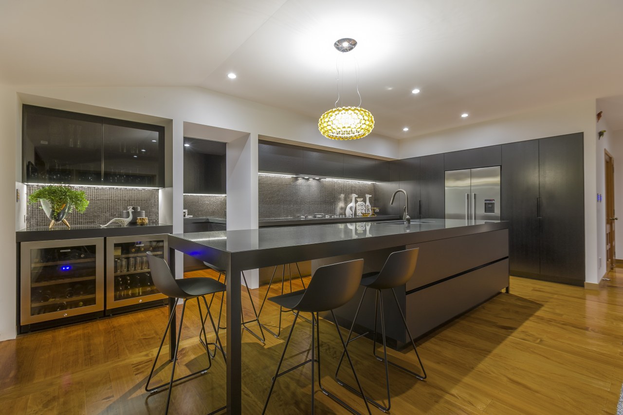 This substantial island in a kitchen by designer apartment, house, interior design, kitchen, real estate, room, brown, gray